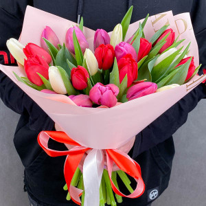 Spring on the palms - a bouquet of red roses